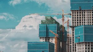 Construction site with blue skies and bright white clouds in the background.